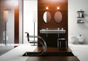 Contemporary bathroom layout featuring a double washbasin set against a warm wood panel divider, with a stylish chrome chair in the foreground.