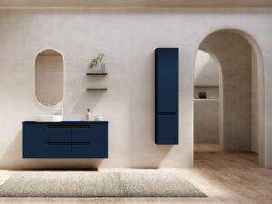 Modern bathroom furniture featuring a Royo Econic double vanity in matte navy blue with four soft-close drawers and an oval mirror.
