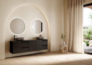 Luxury large-format bathroom furniture composition by Royo Econic in matte black, featuring asymmetrical storage, a grey Piombo worktop, and an illuminated Halo mirror.