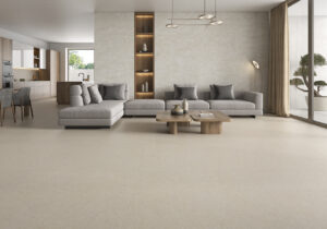 Elegant open-plan living room with large-format porcelain flooring inspired by malta stone.