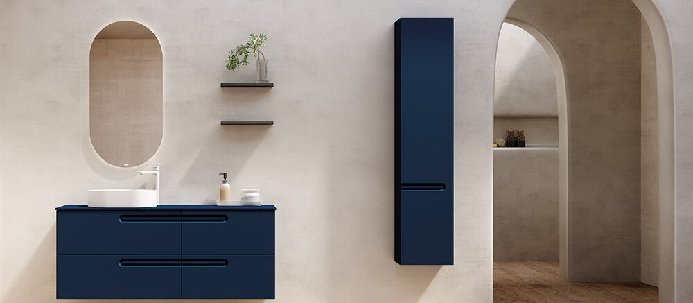 Modern bathroom furniture featuring a Royo Econic double vanity in matte navy blue with four soft-close drawers and an oval mirror.