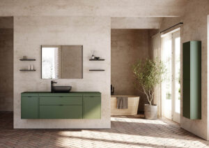 Modern bathroom with green cabinetry and matte black fixtures. A large mirror, shelves with decor, and a potted plant add elegance. Natural light fills the space.