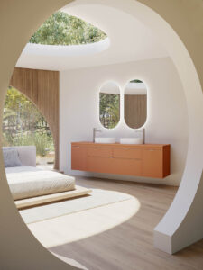 Sophisticated bathroom furniture arrangement showcasing the Royo Logika vanity units and modular storage cabinets in a warm Terracota Pure finish.