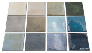 A grid of twelve square ceramic tiles by Equipe, showcasing a variety of colors and textures from earthy beige and grey to glossy blues and greens.